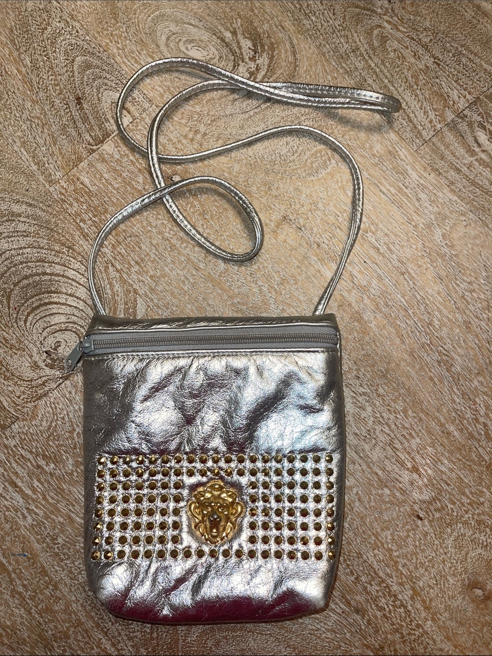 Vintage Metallic Silver Crossbody Bag with Gold Lion Accent